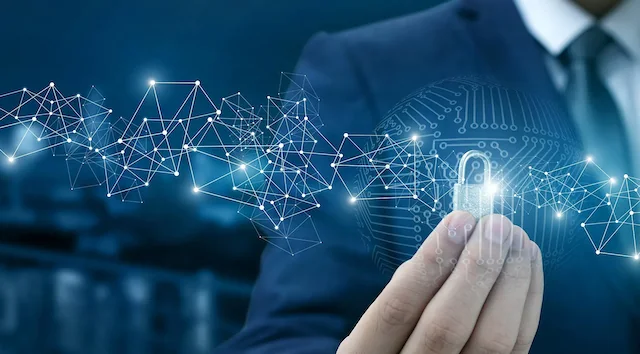 A hand touching a glowing network diagram