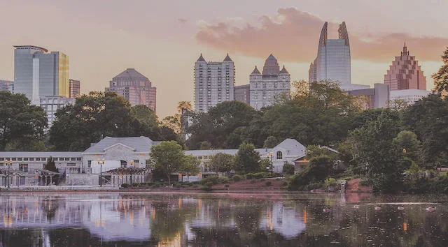 The Atlanta skyline across a park