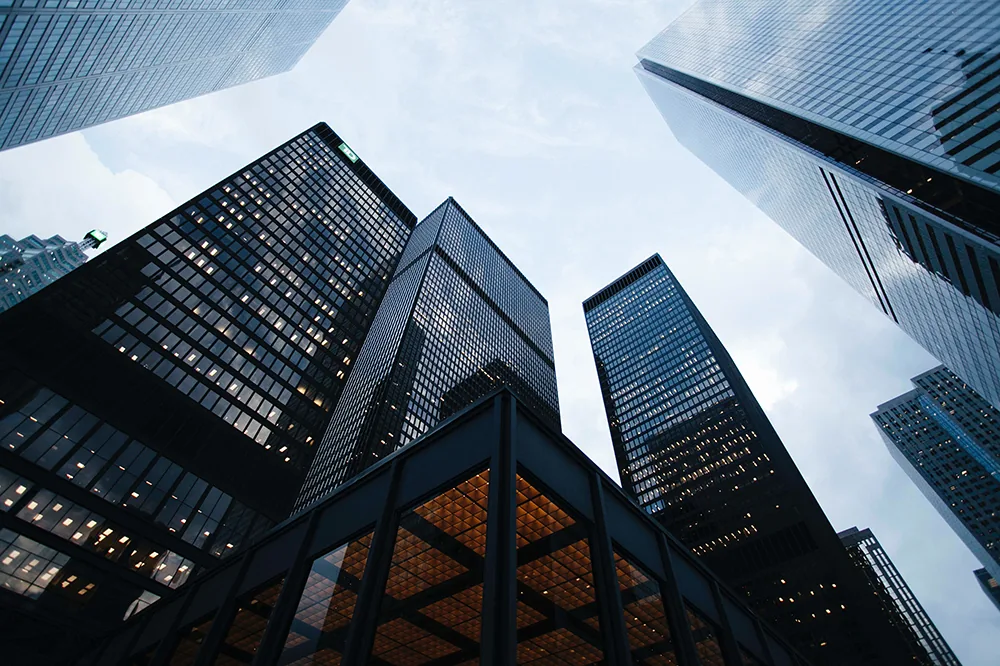 Glass office towers seen from below
