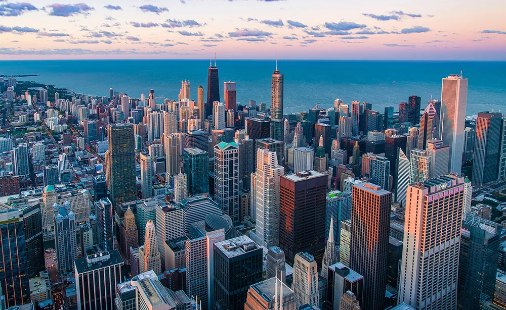 A city skyline of office towers along the waterfront